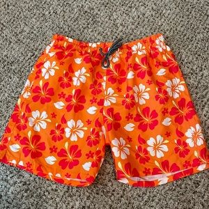 Size L, swim trunks, never worn, front pocket & back pocket